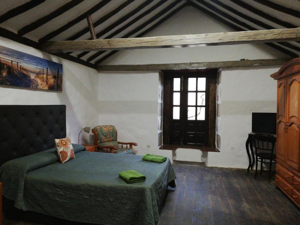 Postel nebo postele na pokoji v ubytování Casa rural el Burro