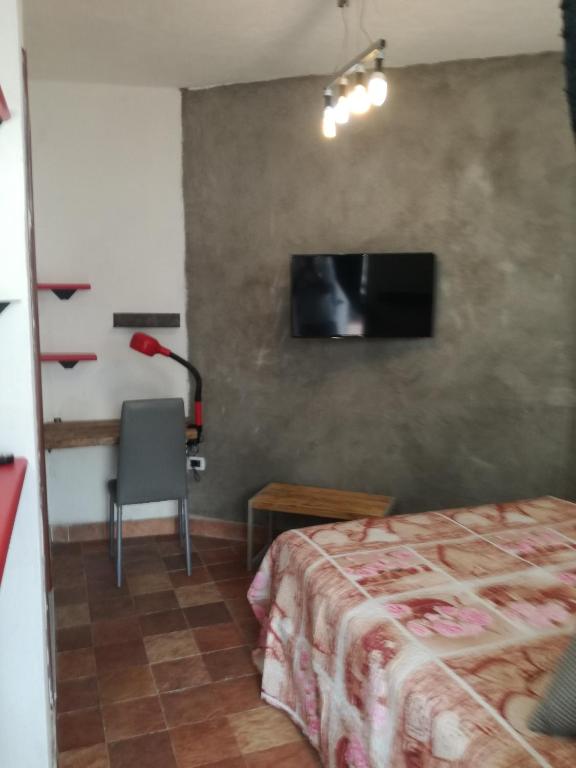 Łóżko lub łóżka w pokoju w obiekcie B&B PompeiLog