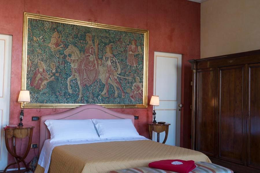 Posteľ alebo postele v izbe v ubytovaní Luxory suite su Lungarno
