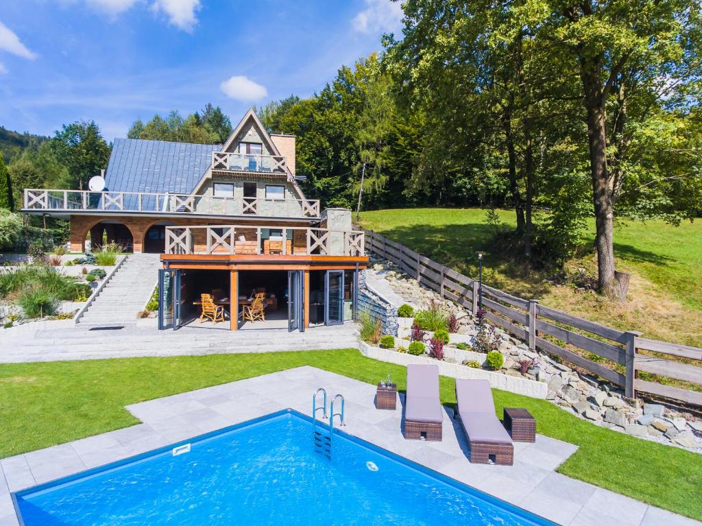an aerial view of a house with a swimming pool at Dom Beskidy in Brenna