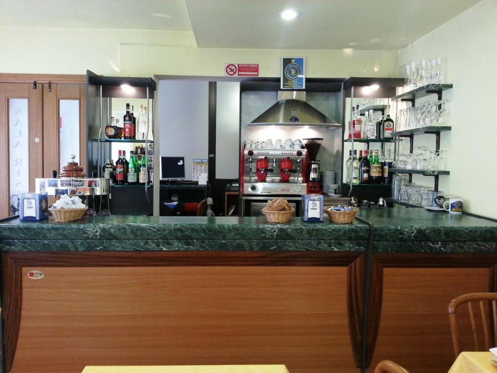 Kuchyň nebo kuchyňský kout v ubytování Hotel Clodia