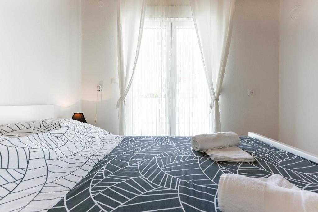 Łóżko lub łóżka w pokoju w obiekcie Diva Apartment
