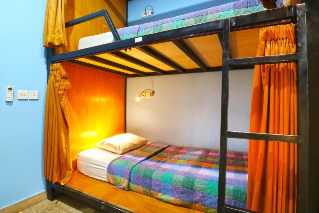 Postel nebo postele na pokoji v ubytování New Ubud Hostel