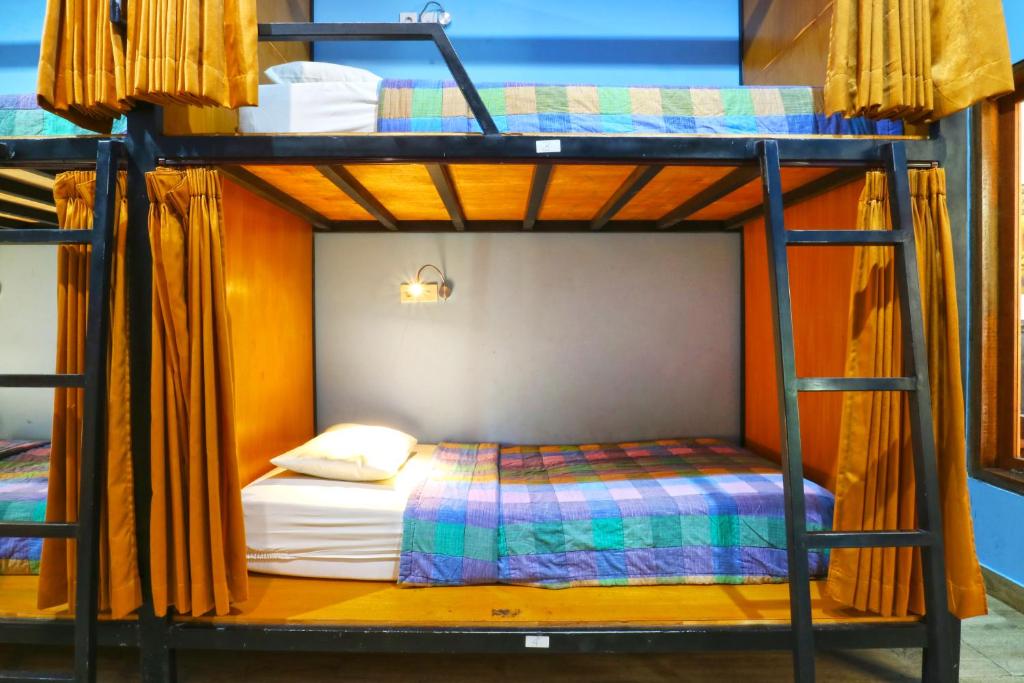 Postel nebo postele na pokoji v ubytování New Ubud Hostel
