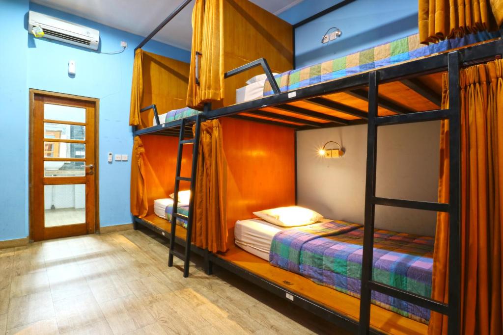 Postel nebo postele na pokoji v ubytování New Ubud Hostel