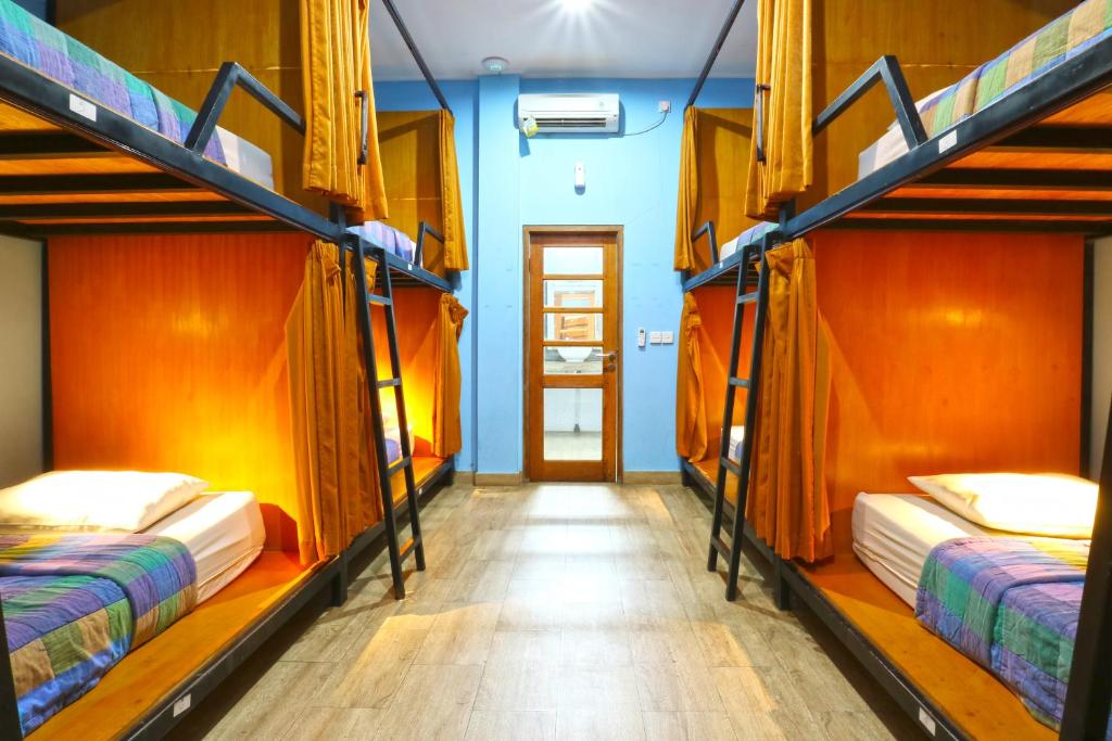 Postel nebo postele na pokoji v ubytování New Ubud Hostel