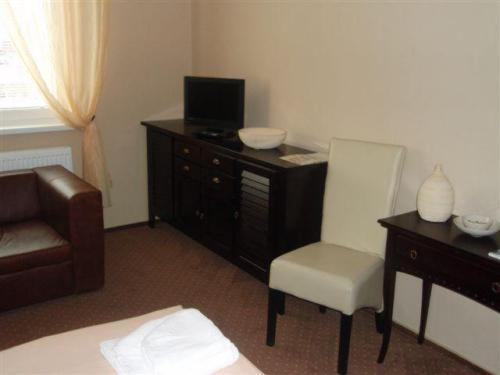 TV a/nebo společenská místnost v ubytování Hotel Galileo