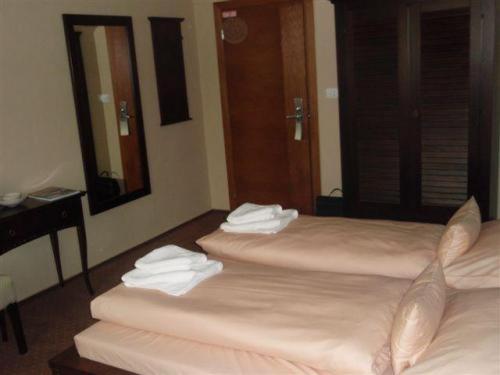 Postel nebo postele na pokoji v ubytování Hotel Galileo