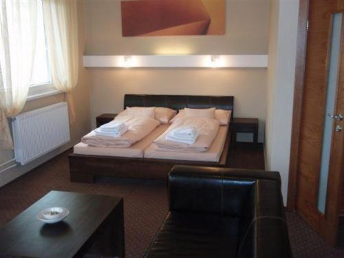 Postel nebo postele na pokoji v ubytování Hotel Galileo