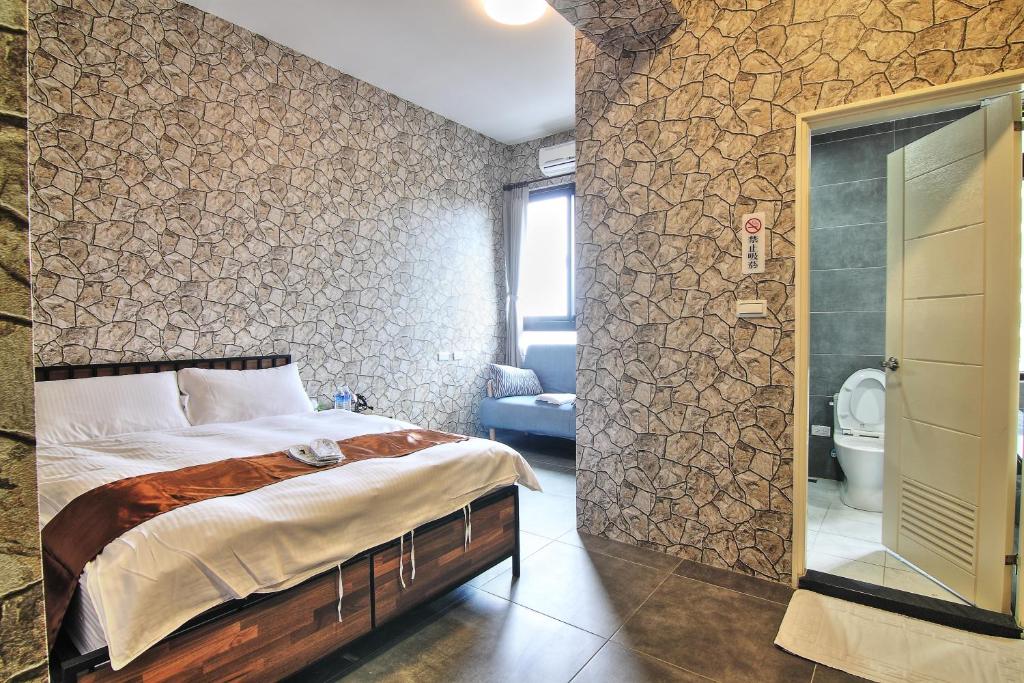 Postel nebo postele na pokoji v ubytování Yixiang Spring Travel