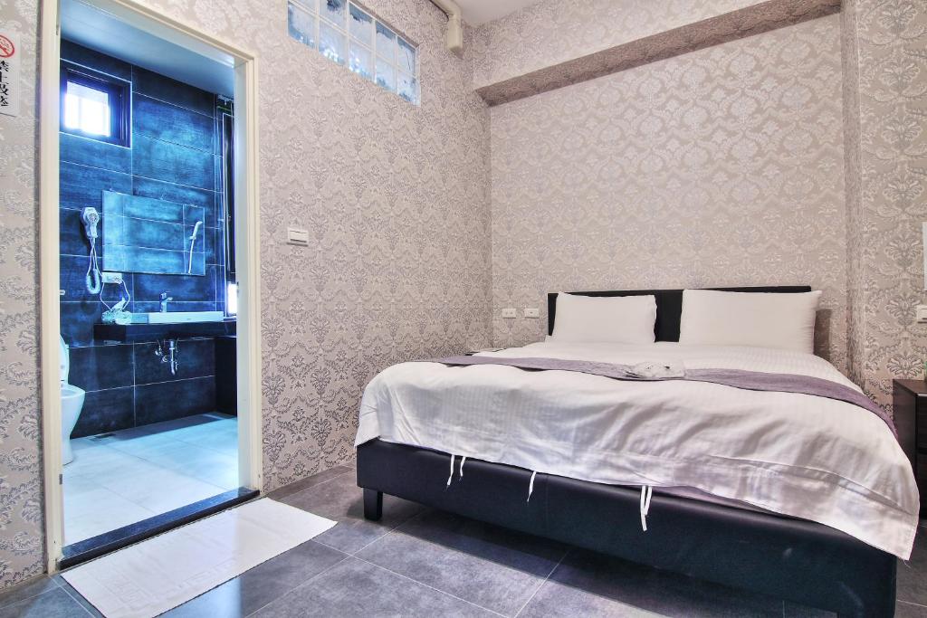 Postel nebo postele na pokoji v ubytování Yixiang Spring Travel