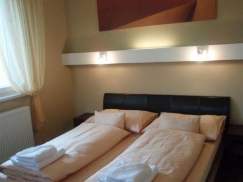 Postel nebo postele na pokoji v ubytování Hotel Galileo
