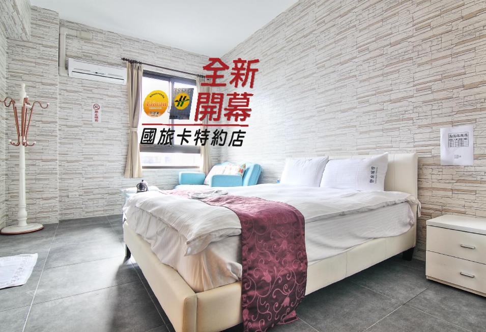 Postel nebo postele na pokoji v ubytování Yixiang Spring Travel