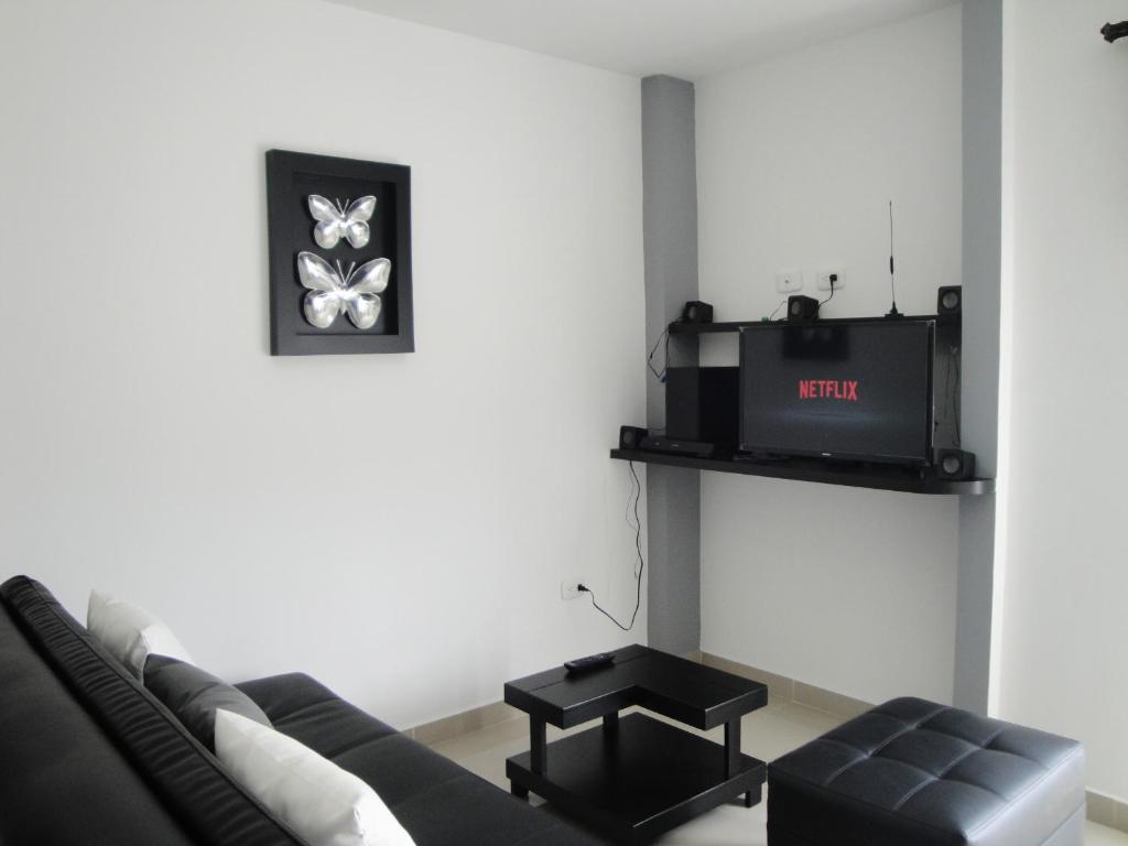 TV a/nebo společenská místnost v ubytování Santa Isabel Centro 401