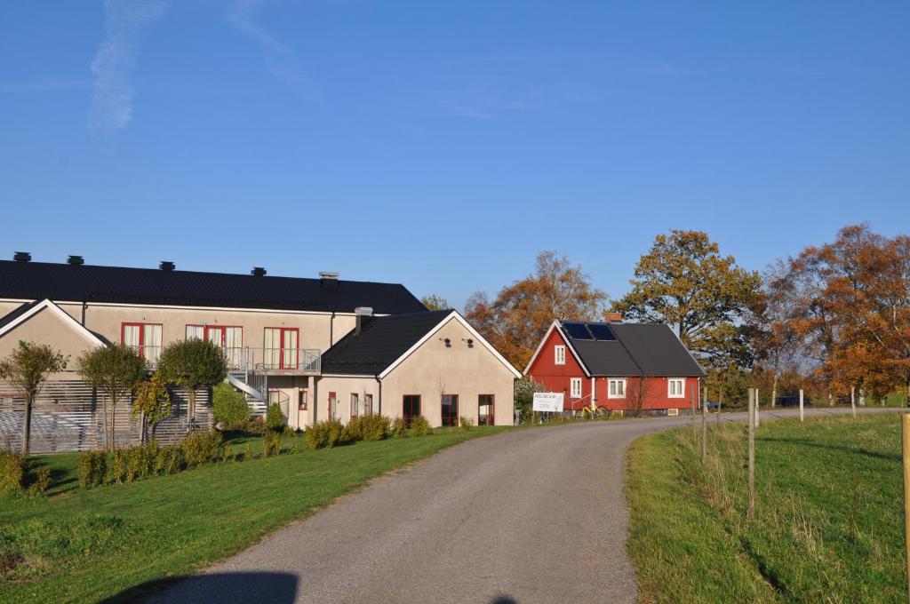 a village with houses and a dirt road at Hotel Bella Luna in Båstad