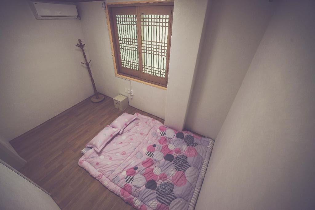 Postel nebo postele na pokoji v ubytování Wansangolgh Guest House