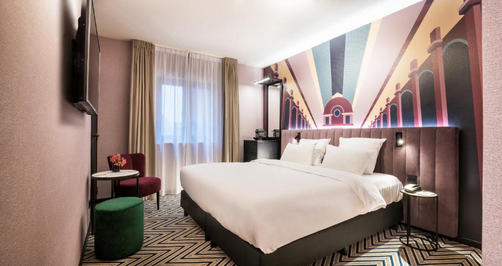 Krevet ili kreveti u jedinici u okviru objekta Hotel Hubert Grand Place