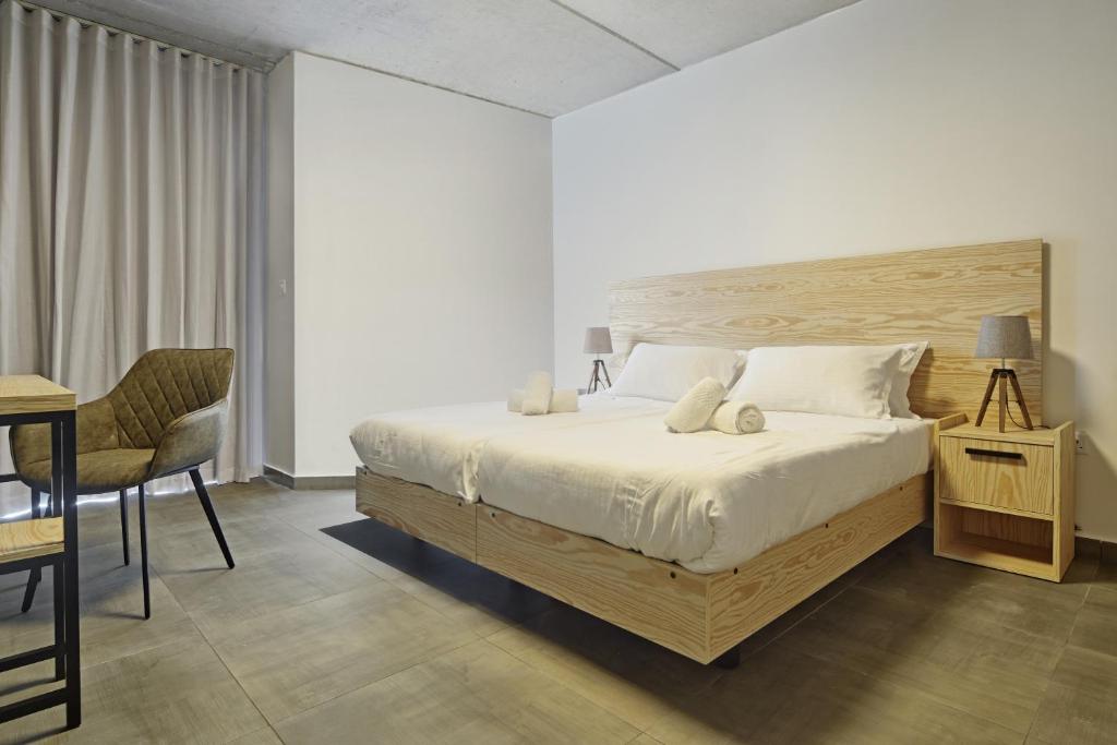 Postel nebo postele na pokoji v ubytování Mr Todd Hotel