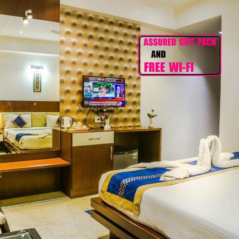 TV a/nebo společenská místnost v ubytování Hotel Taj Heights