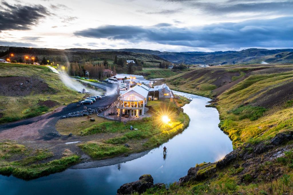 an aerial view of a house on a river at Frost and Fire Hotel in Hveragerði