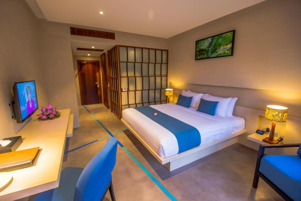 Postel nebo postele na pokoji v ubytování Sakmut Boutique Hotel
