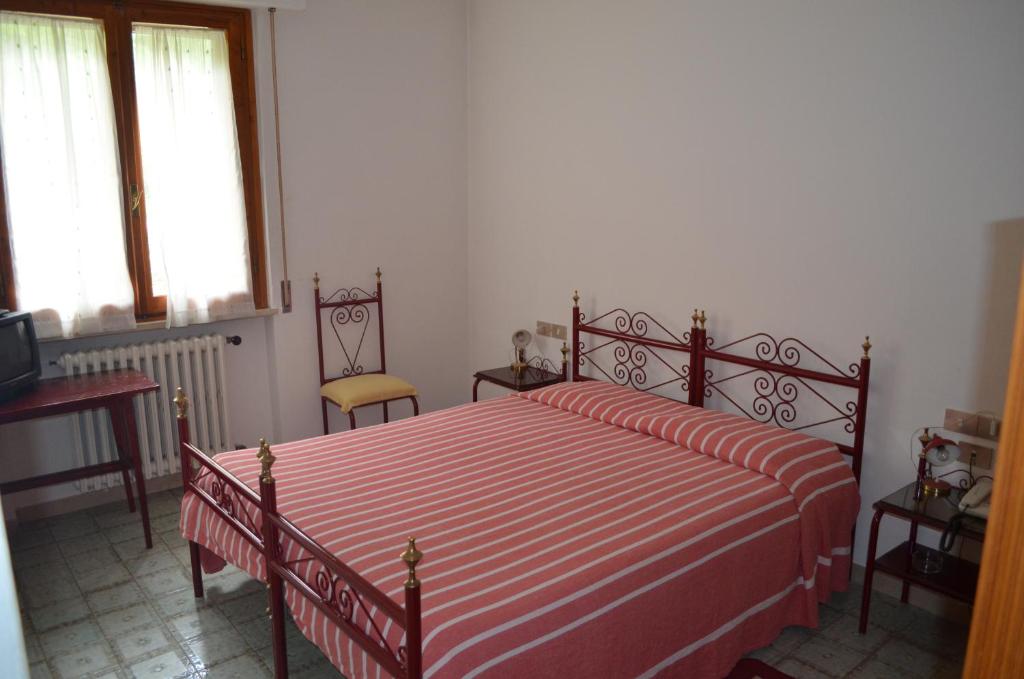 Postel nebo postele na pokoji v ubytování Albergo Padellino