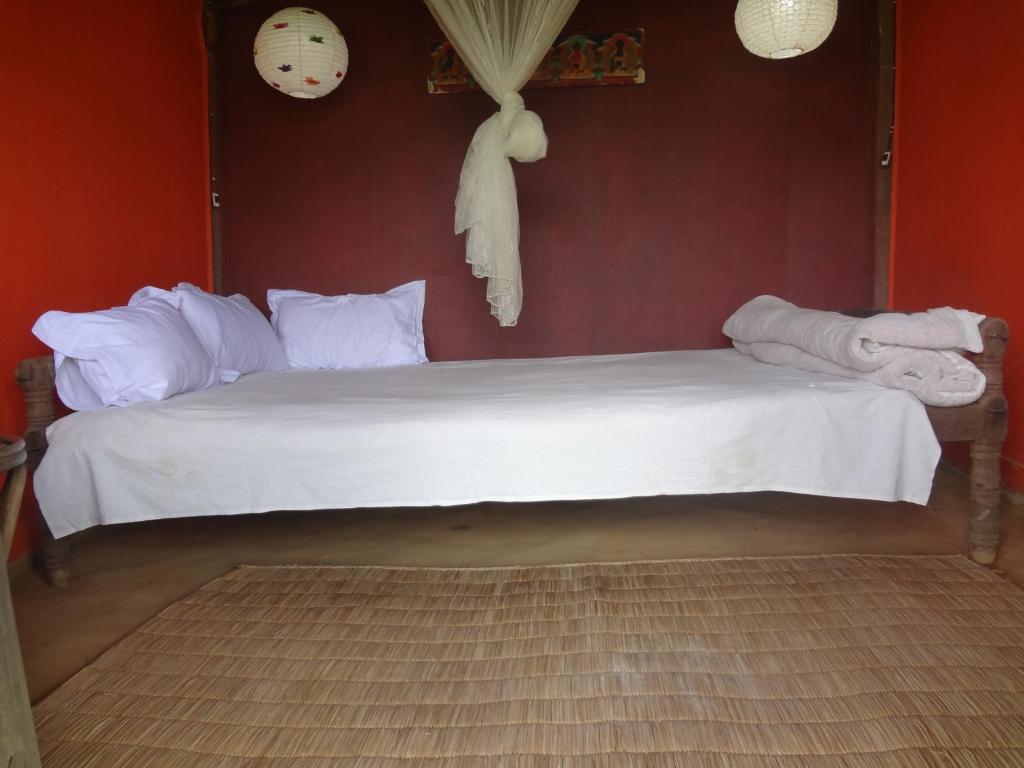 Postel nebo postele na pokoji v ubytování Shanta Ghar A Rustic Guesthouse