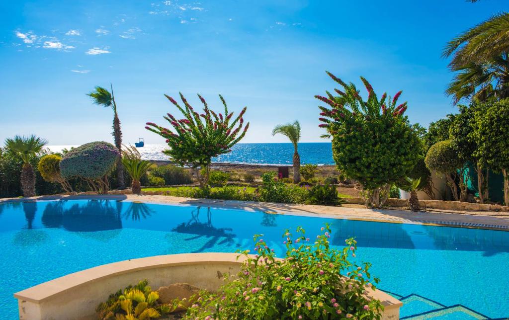 a swimming pool with a view of the ocean at Luxury holiday villa Apollo 9 in Paphos