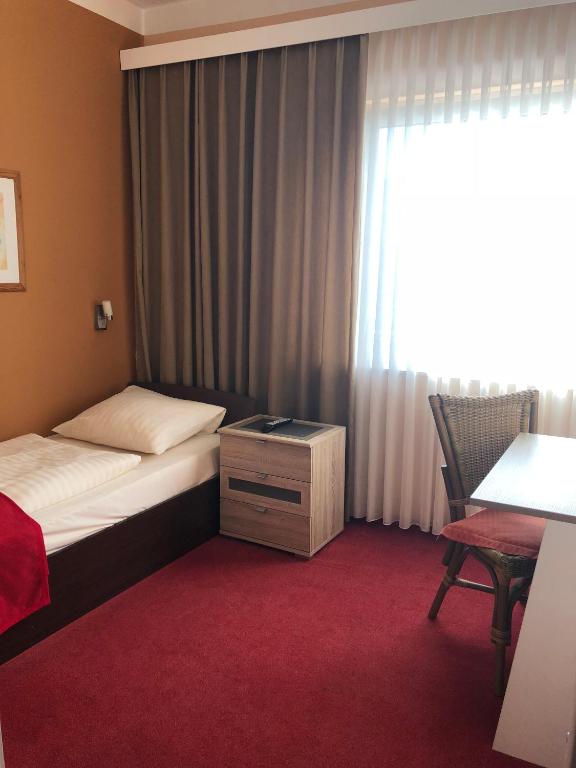 Ein Bett oder Betten in einem Zimmer der Unterkunft Hotel Imperial