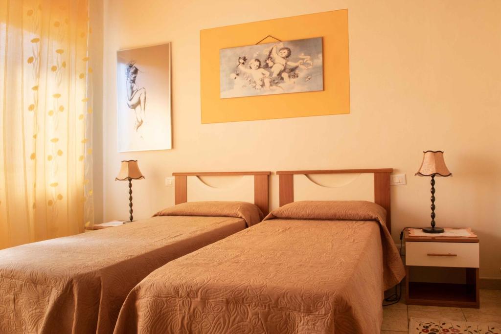 Łóżko lub łóżka w pokoju w obiekcie Al Frantoio Maddii Levane bed and breakfast