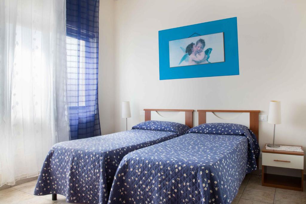 Łóżko lub łóżka w pokoju w obiekcie Al Frantoio Maddii Levane bed and breakfast