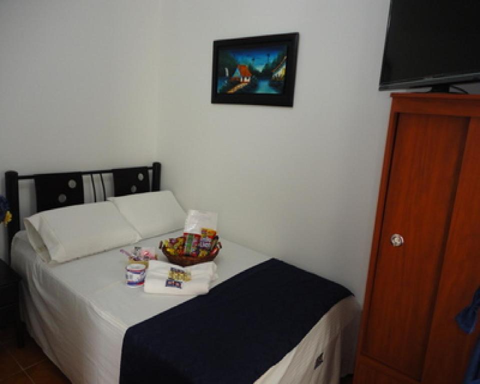 Postel nebo postele na pokoji v ubytování Hotel Casa Sabelle
