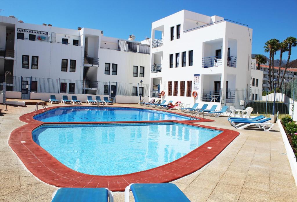 a large swimming pool in front of a building at FN FUNCHAL Tenerife 101 in El Guincho