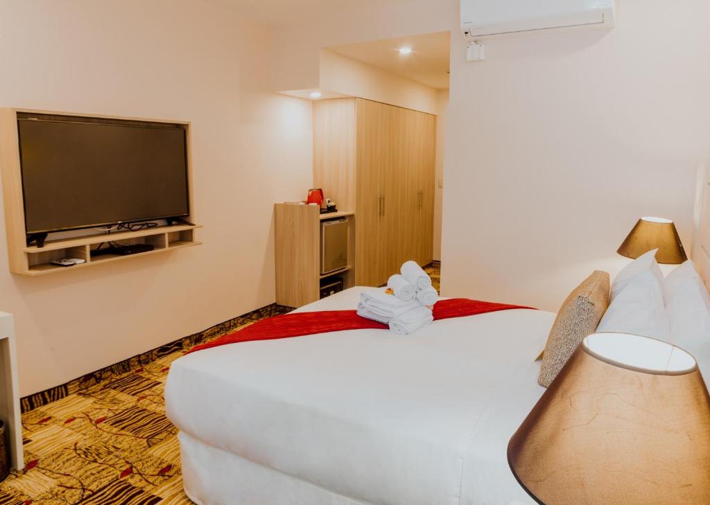 Postel nebo postele na pokoji v ubytování Nobility Grand Hotel
