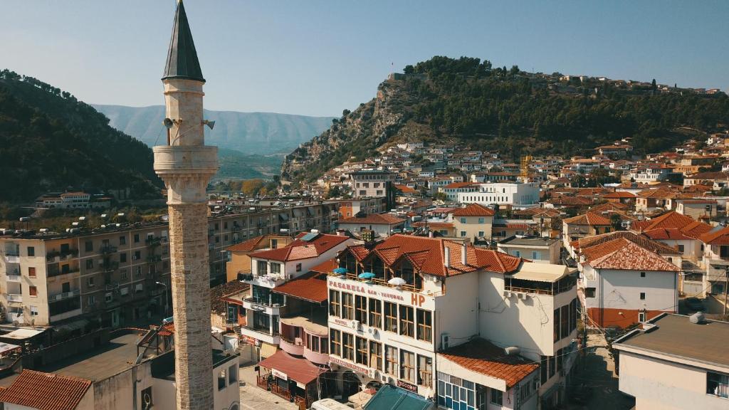 a view of a city with a mosque at Hotel Pasarela in Berat