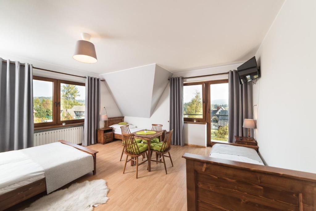 Ένα ή περισσότερα κρεβάτια σε δωμάτιο στο Szyszka