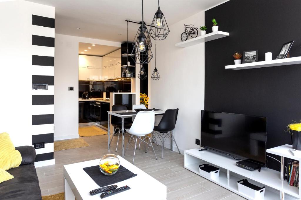 a living room with a black and white wall at Park Apartment in Novi Sad