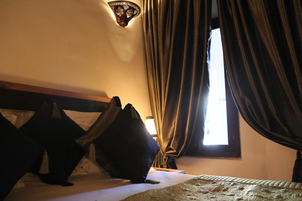 Postel nebo postele na pokoji v ubytování Riad Terra Bahia