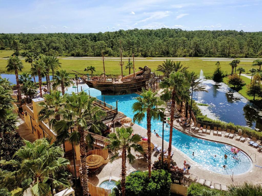 an aerial view of a pool at a resort at Lake Buena Vista Resort Village and Spa, Near Disney in Orlando
