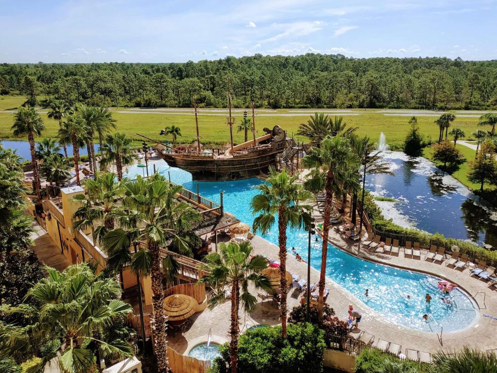 an aerial view of a pool at a resort at Lake Buena Vista Resort Village and Spa, a staySky Hotel & Resort Near Disney in Orlando