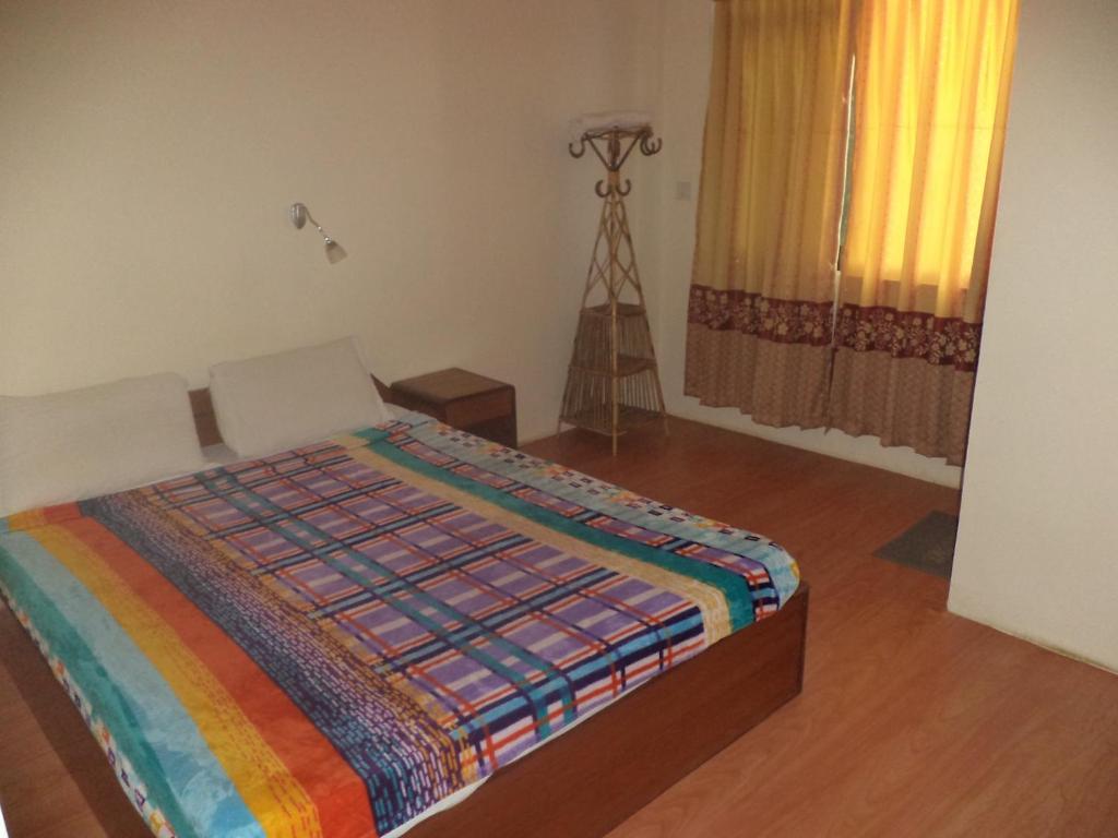Postel nebo postele na pokoji v ubytování Seven Steps Guest House