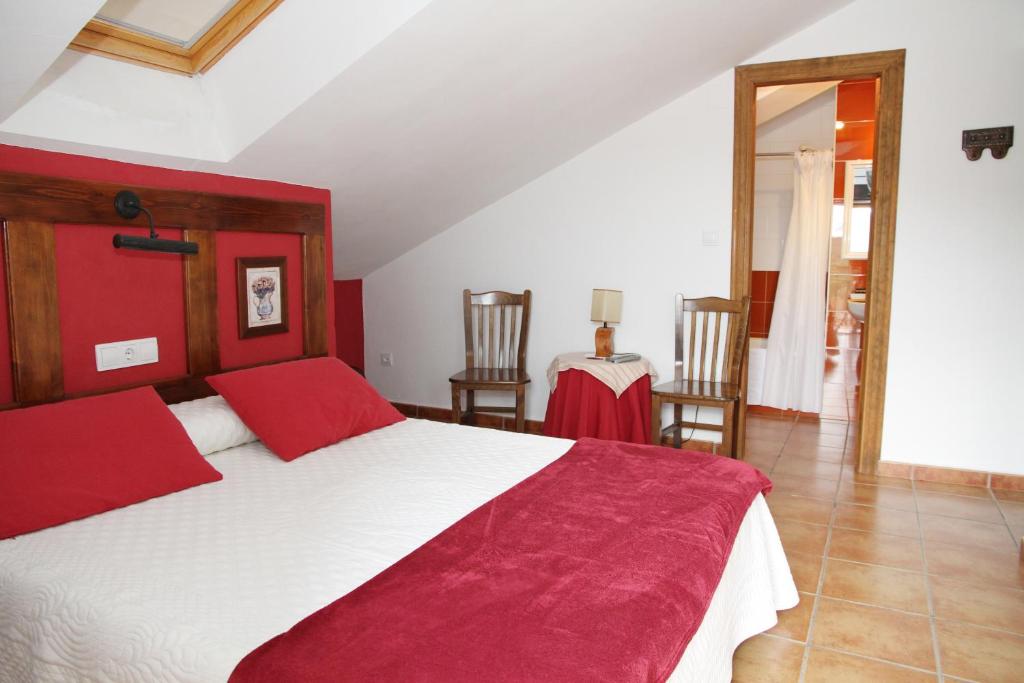Postel nebo postele na pokoji v ubytování Hotel Rural Valle del Tuejar