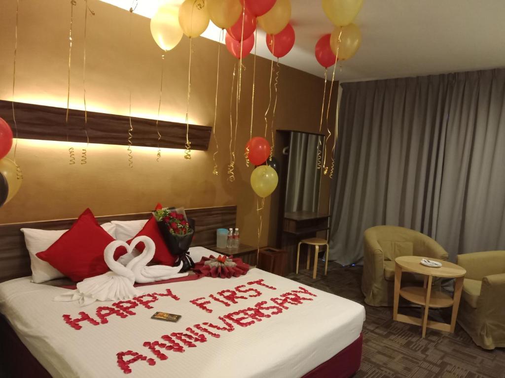Postel nebo postele na pokoji v ubytování De Botani Hotel
