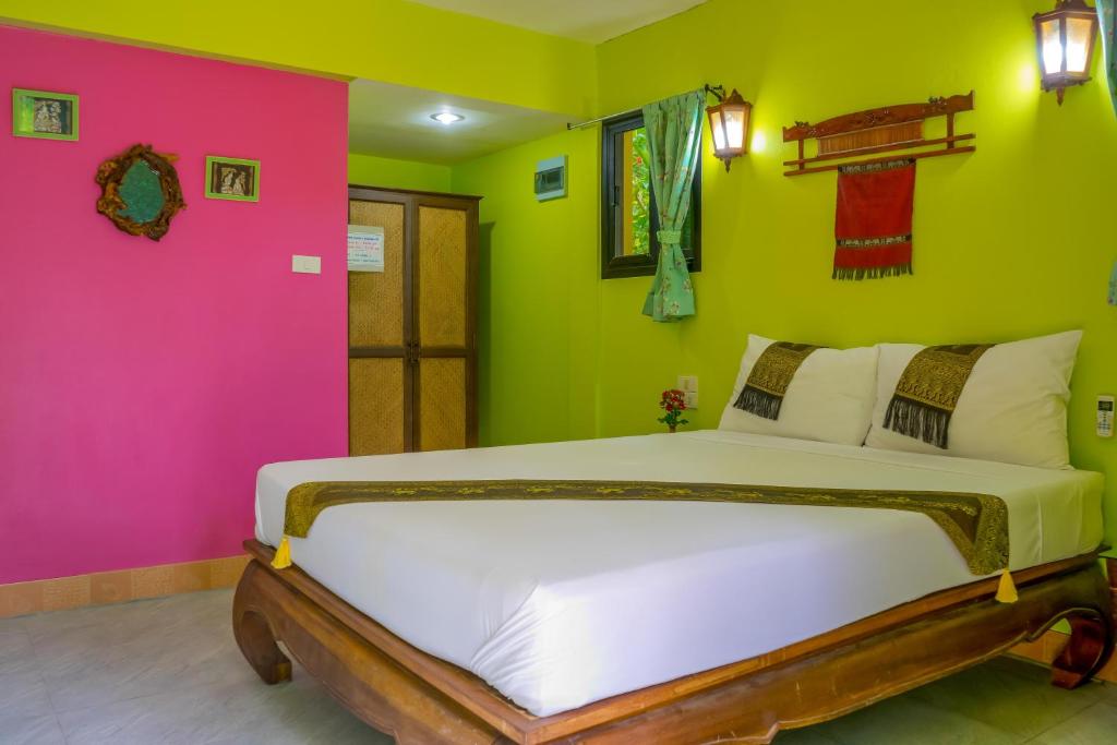 Postel nebo postele na pokoji v ubytování Chez Charly Bungalow