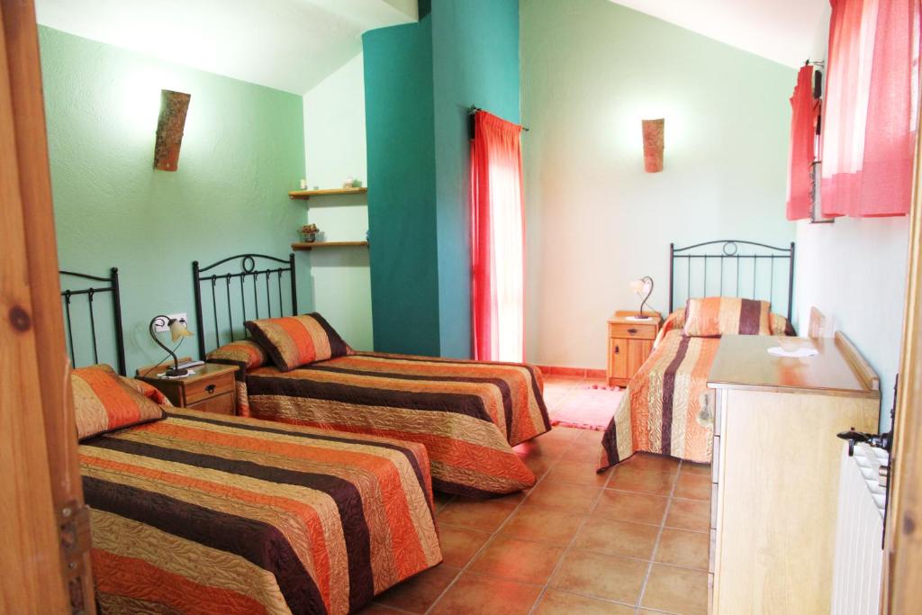 Postel nebo postele na pokoji v ubytování Hotel Rural Valle del Tuejar