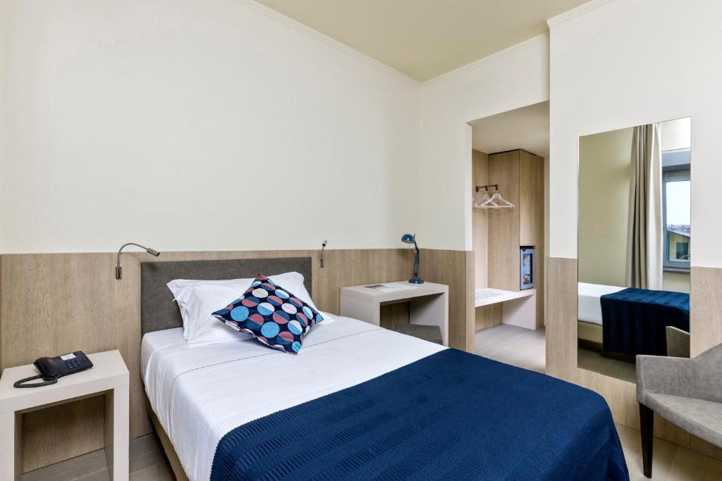 Postel nebo postele na pokoji v ubytování Living Hotel Milano