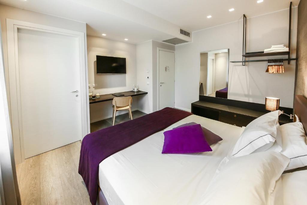 A bed or beds in a room at La Bella Modena