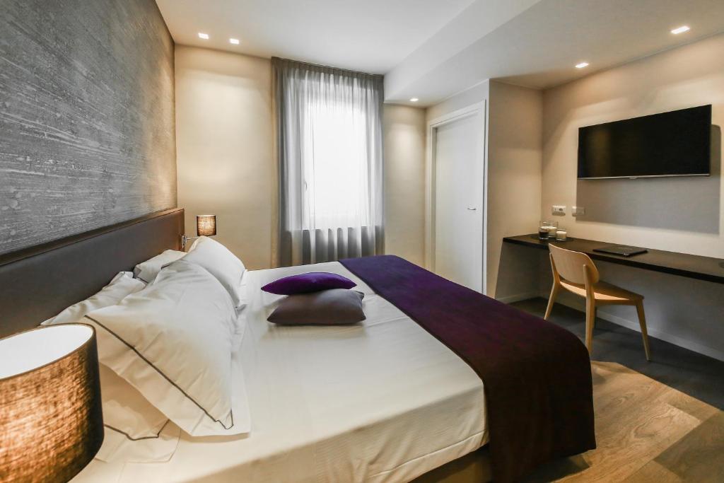 A bed or beds in a room at La Bella Modena