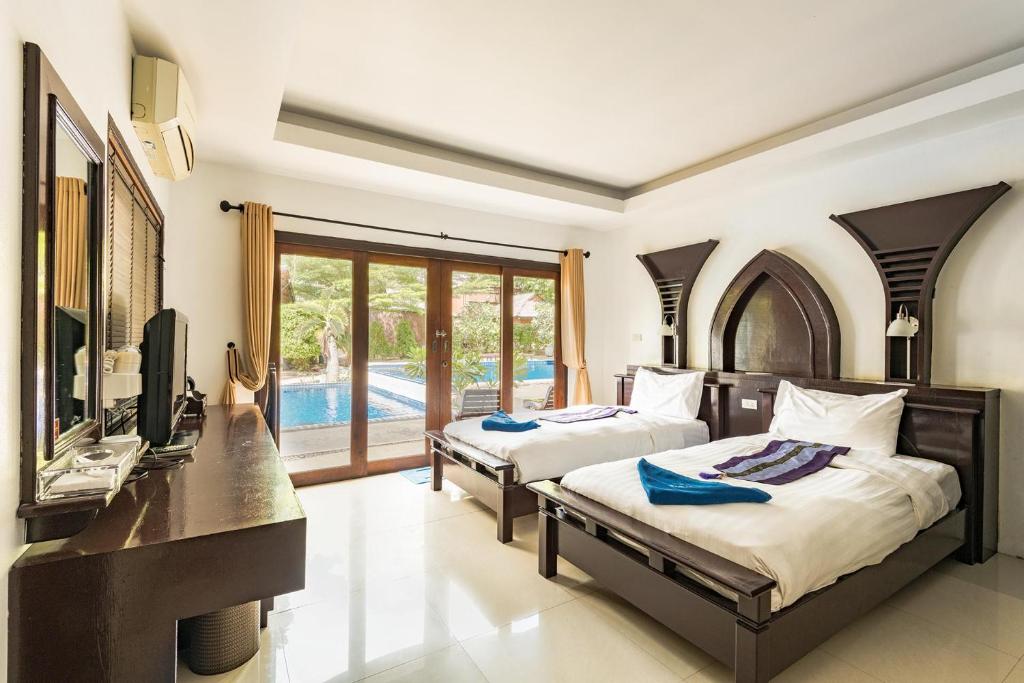 Koh Tao Regal Resort - SHA Plus 객실 침대
