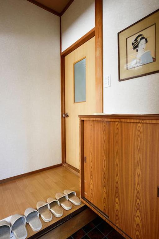 a room with a row of shoes on the floor at City Hotel Universal Studios Japan in Osaka
